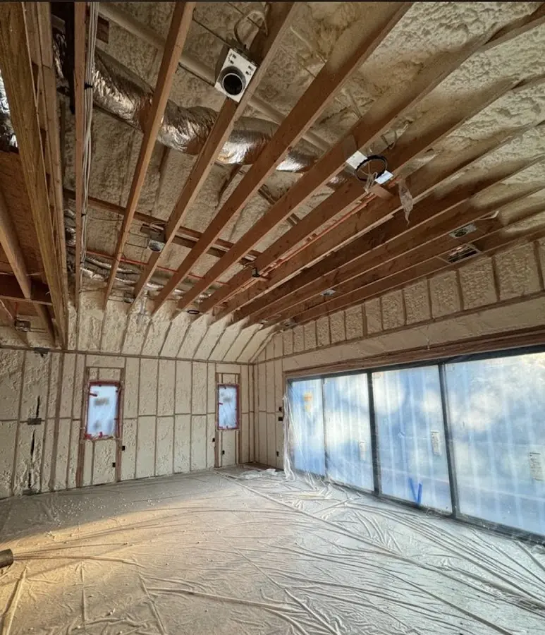 Interior walls and ceiling insulated with spray foam during new construction in Mesa